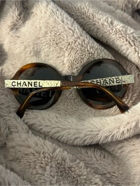 CHANEL Tortoiseshell Round Sunglasses with Gold Hammered Logo